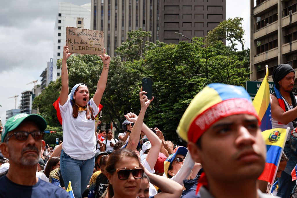 Supporters gather in Caracas, Venezuela, on July 30, 2024, to listen to opposition leaders María Corina Machado and Edmundo González during a protest against the result of the Venezuelan presidential election. (Photo by Jesus Vargas/Getty Images)