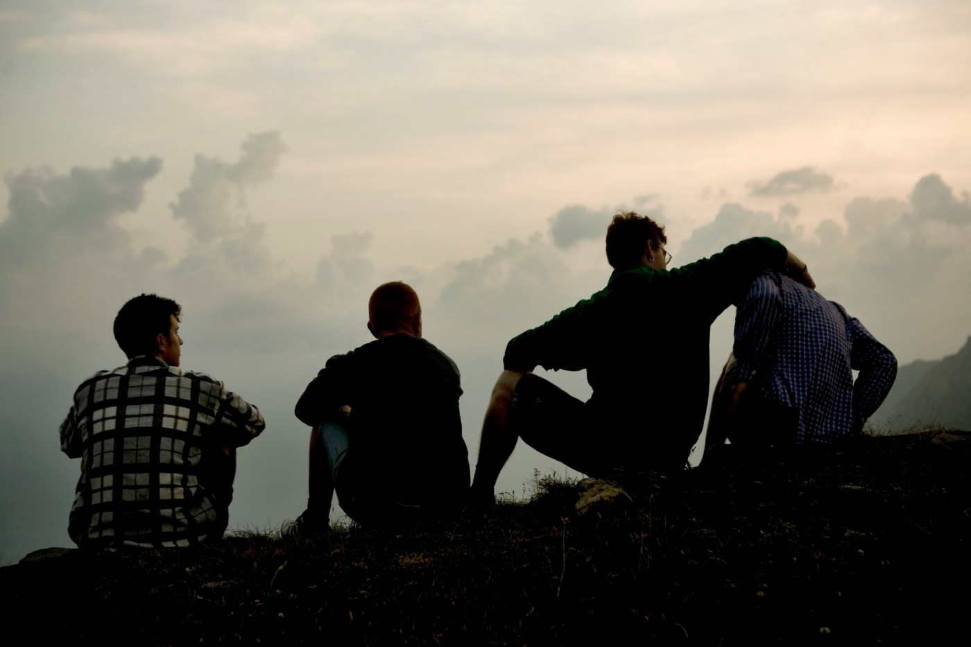 Four men on the ridge of a mountain