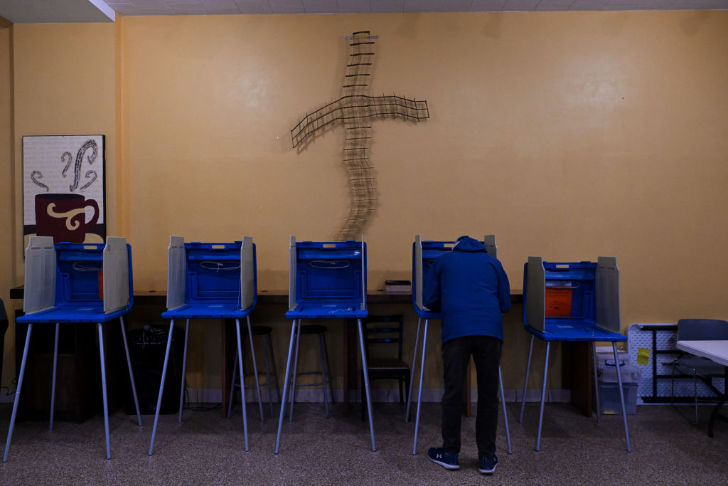 A voter fills out a ballot at a polling station at St. Joseph Catholic Church and School on April 2, 2024, in Green Bay, Wisconsin. (Photo by Joshua Lott/The Washington Post via Getty Images)