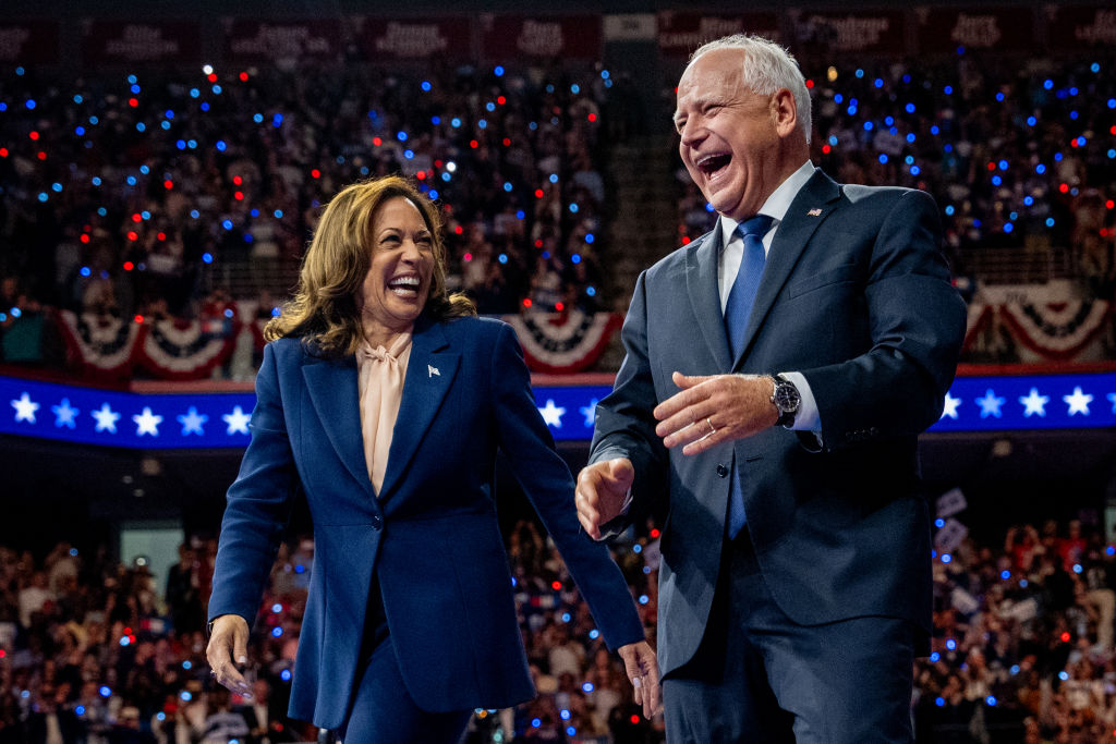 Vice President Kamala Harris and Minnesota Gov. Tim Walz walk out on stage together during a campaign event in Philadelphia, Pennsylvania on August 6, 2024. (Photo by Andrew Harnik/Getty Images)