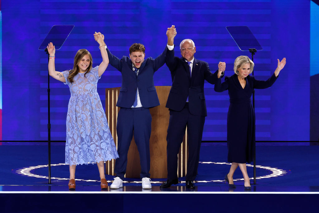 Minnesota Gov. Tim Walz celebrates with his daughter Hope, son Gus, and wife Gwen after accepting the Democratic vice presidential nomination on stage during the third day of the Democratic National Convention on August 21, 2024 in Chicago.  (Photo by Chip Somodevilla/Getty Images)