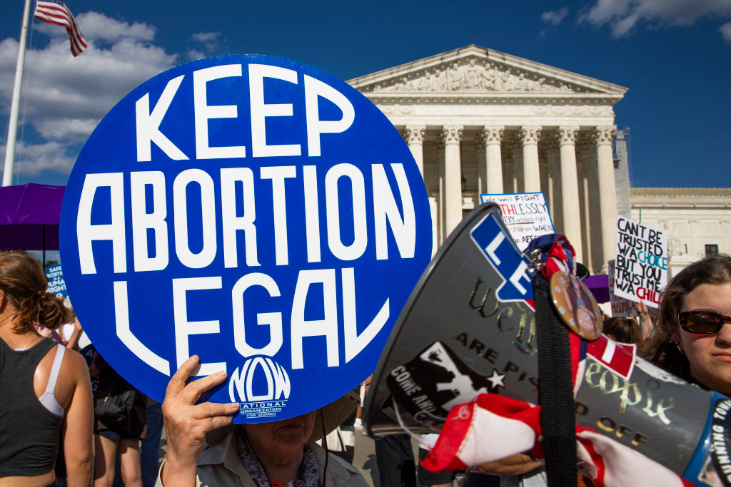 A woman holds a sign as abortion rights activists protest in front of the Supreme Court in Washington, D.C., on June 24, 2024. (Photo by AASHISH KIPHAYET/Middle East Images/AFP via Getty Images)