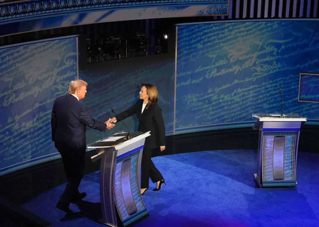 Vice President and Democratic presidential candidate Kamala Harris and former President and Republican presidential candidate Donald Trump shake hands ahead of the presidential debate at the National Constitution Center in Philadelphia, Pennsylvania, on September 10, 2024. (Photo by Demetrius Freeman/The Washington Post via Getty Images)