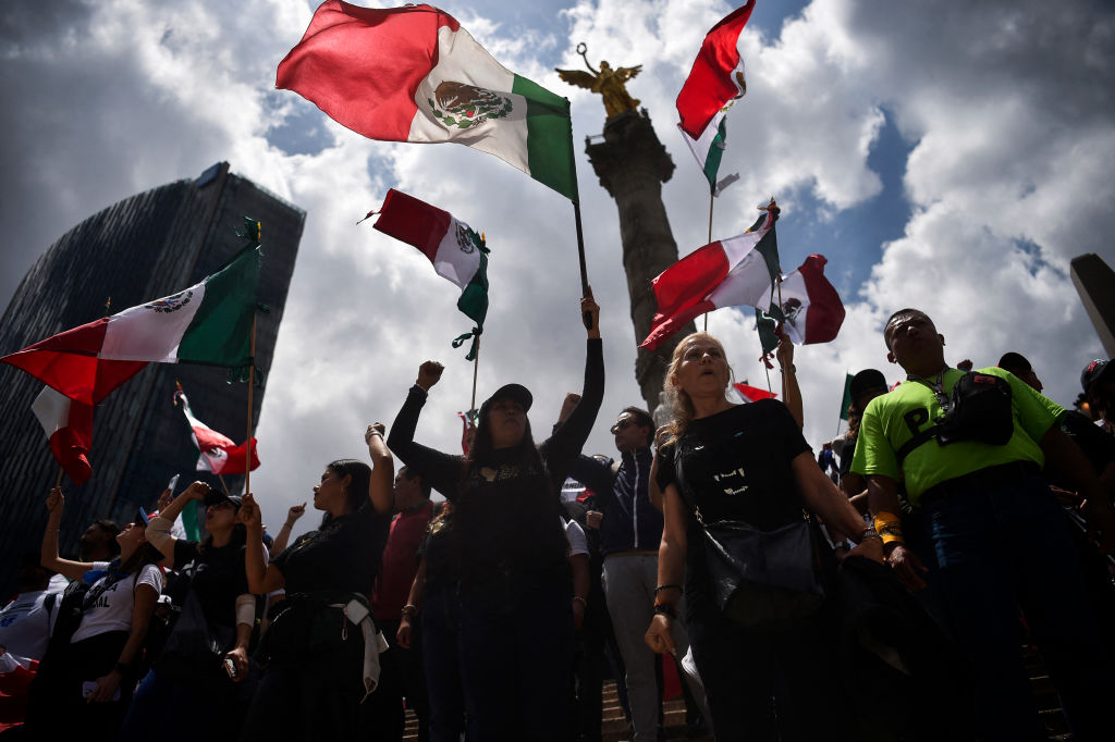 Members of the National Association of Magistrates and District Judges take part in a protest at the Angel de la Independencia roundabout in Mexico City on September 11, 2024, following the Mexican Senate's approval of a judicial reform package. (Photo by RODRIGO OROPEZA/AFP via Getty Images)