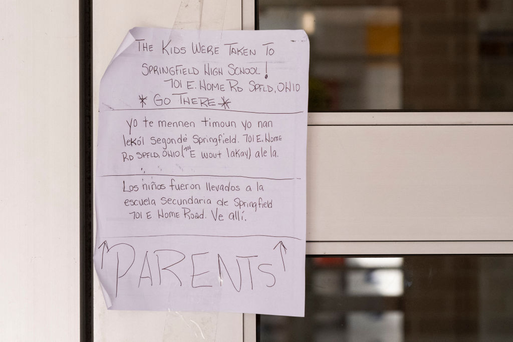 A note on the front door of Fulton Elementary School in Springfield, Ohio, advises parents wanting to pick up their children to go to another school nearby for pick up after the school was evacuated on September 12, 2024, following bomb threats that were made earlier in the day. (Photo by ROBERTO SCHMIDT/AFP via Getty Images)