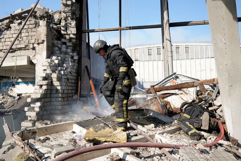 Rescue workers conduct a search and rescue operation in a sports complex building partially destroyed by Russian shelling on September 1, 2024, in Kharkiv, Ukraine. (Photo by Eugene Hertnier/Suspilne Ukraine/JSC 