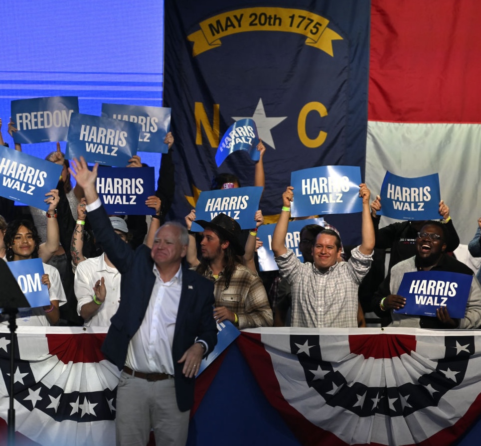 Minnesota Gov. Tim Walz greets people as he attends a rally in Asheville, North Carolina, on September 17, 2024. (Photo by Peter Zay/Anadolu via Getty Images)