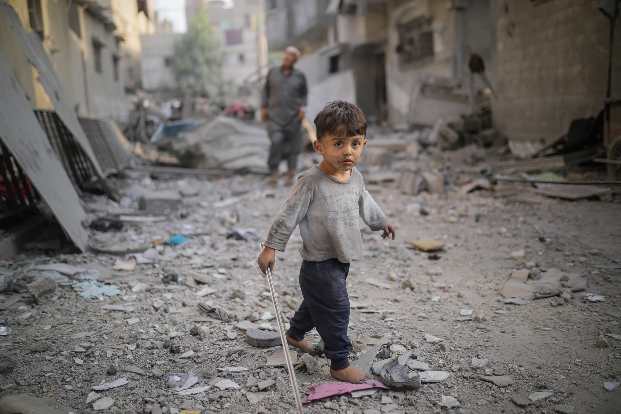 A child walks among the rubble of destroyed buildings in Khan Yunis, Gaza, on October 25, 2023, following Israeli airstrikes. (Photo by Belal Khaled/Anadolu via Getty Images)