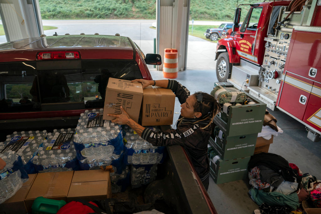 A volunteer unloads supplies at a fire department in Black Mountain, North Carolina, on October 3, 2024. (Photo by ALLISON JOYCE/AFP via Getty Images)