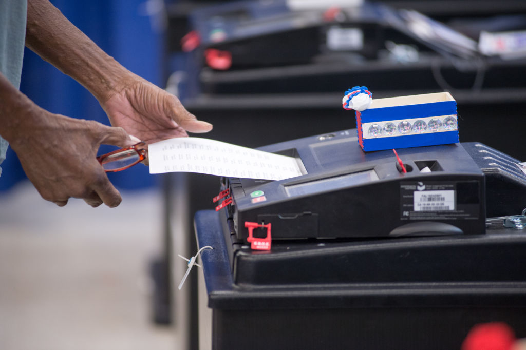 A voter casts a ballot during early voting for the general election at the Voting Supersite in downtown Chicago, Illinois on October 3, 2024. (Photo by Jacek Boczarski/Anadolu via Getty Images)