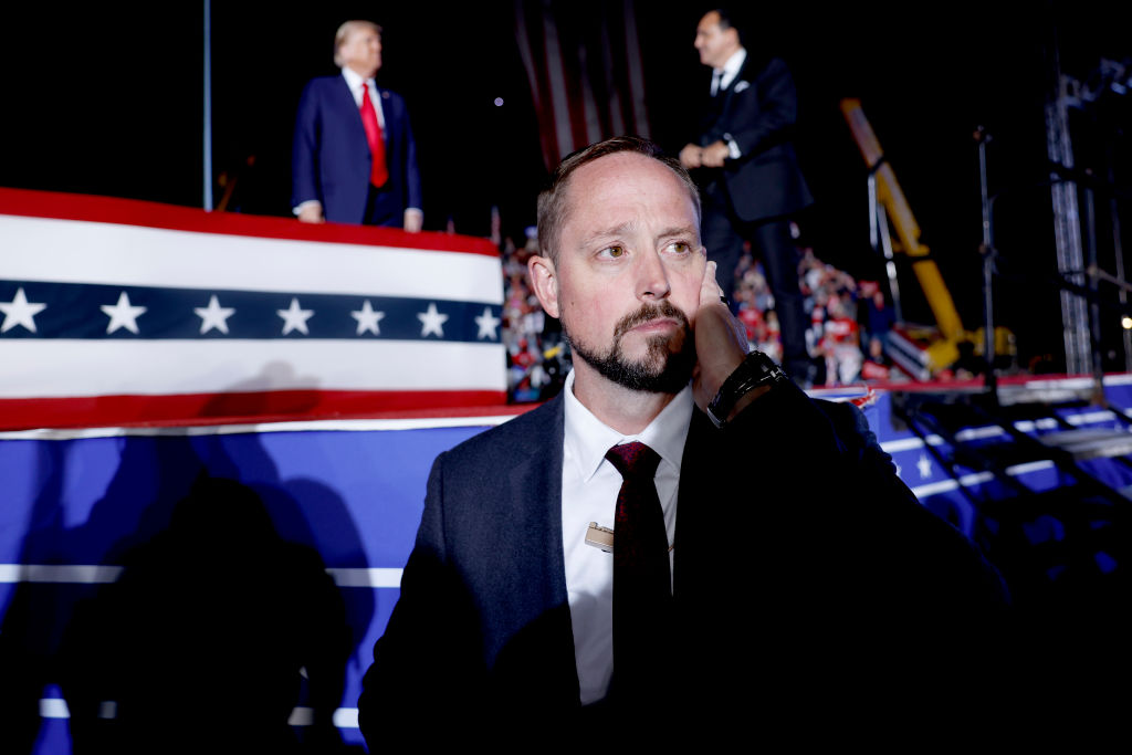 A U.S. Secret Service agent watches the crowd as former President Donald Trump speaks at a campaign rally in Butler, Pennsylvania, on October 5, 2024. (Photo by Anna Moneymaker/Getty Images)