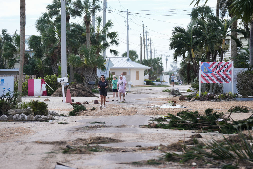 Civilians walk as Florida's first responders are deployed in response to Hurricane Milton in Sarasota, Florida, on October 10, 2024. (Photo by Lokman Vural Elibol/Anadolu via Getty Images)