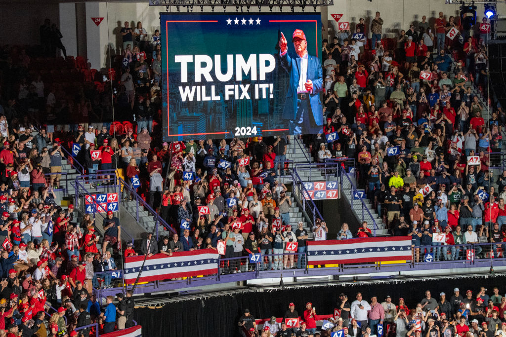 Supporters wait for former President Donald Trump to arrive at a campaign rally at Resch Center in Green Bay, Wisconsin, on October 30, 2024. (Photo by ALEX WROBLEWSKI/AFP via Getty Images)