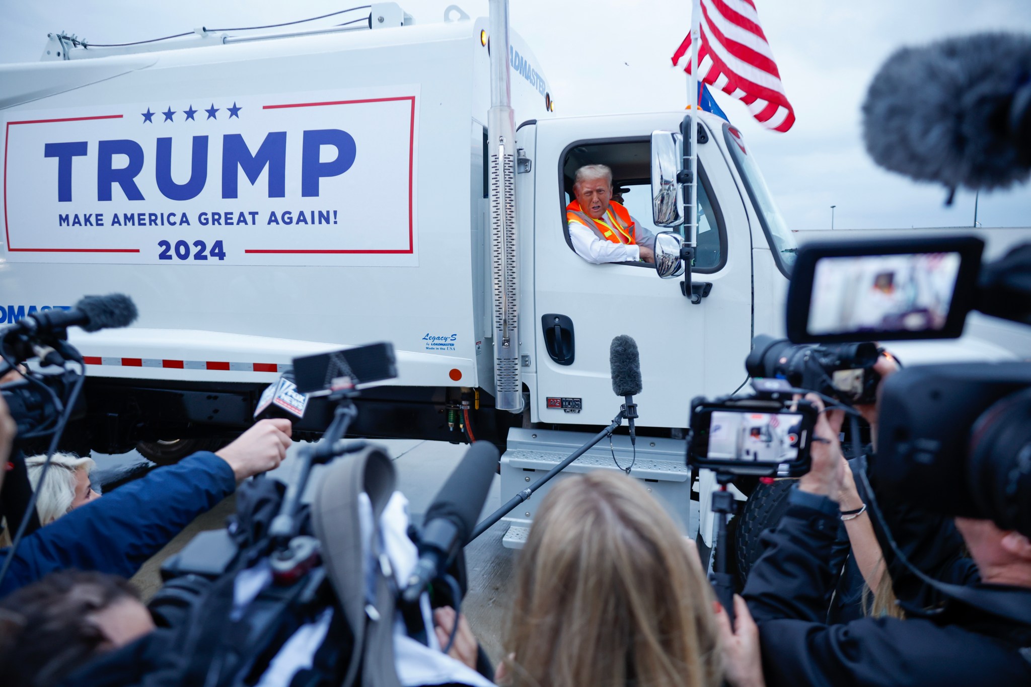 Donald Trump holds a press conference from inside a trash hauler at Green Bay Austin Straubel International Airport on October 30, 2024. (Photo by Chip Somodevilla/Getty Images)