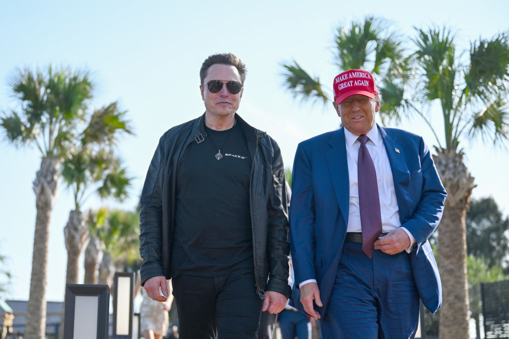 President-elect Donald Trump greets Elon Musk on November 19, 2024, in Brownsville, Texas. (Photo by Brandon Bell/Getty Images)