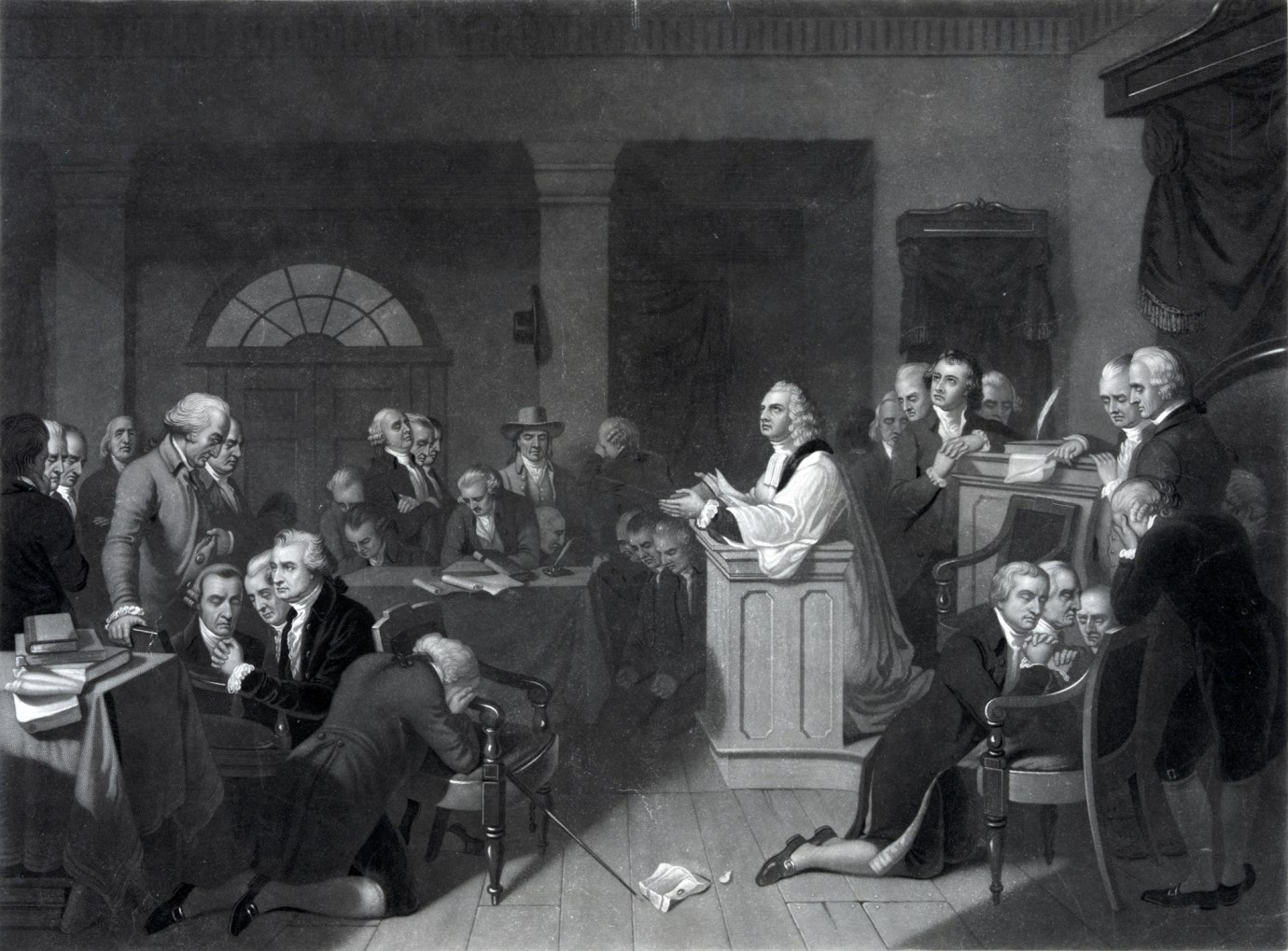 A vintage engraving features a moment of prayer in the first session of the Continental Congress on September 5, 1774. (Image via Getty Images)