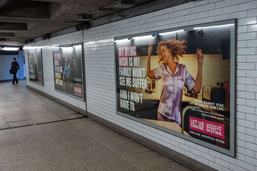 Posters advocating legally assisted suicide by the campaign group Dignity in Dying are displayed in Westminster underground station on November 28, 2024, in London, England. (Photo by Carl Court/Getty Images)