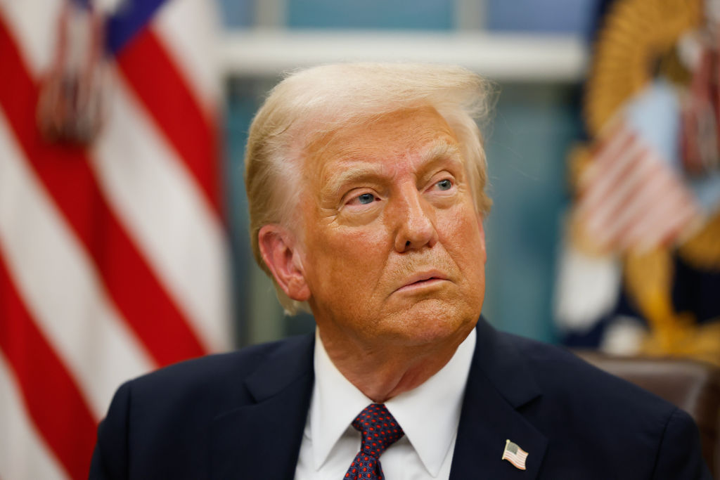 President Donald Trump signs executive orders in the Oval Office on January 20, 2025, in Washington, D.C. (Photo by Anna Moneymaker/Getty Images)