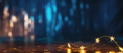 New Year celebration concept with golden lights and champagne flute