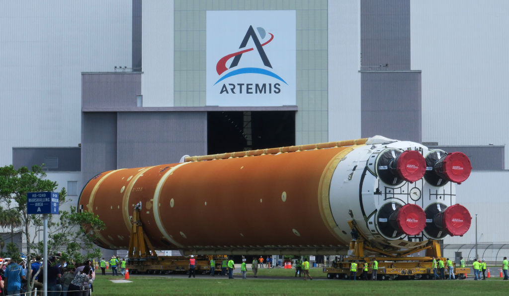 Workers transport the 212-foot-tall SLS core stage for the Artemis II moon rocket to NASA's Kennedy Space Center on July 24, 2024, in Cape Canaveral, Florida. (Photo by Paul Hennessy/Anadolu via Getty Images)