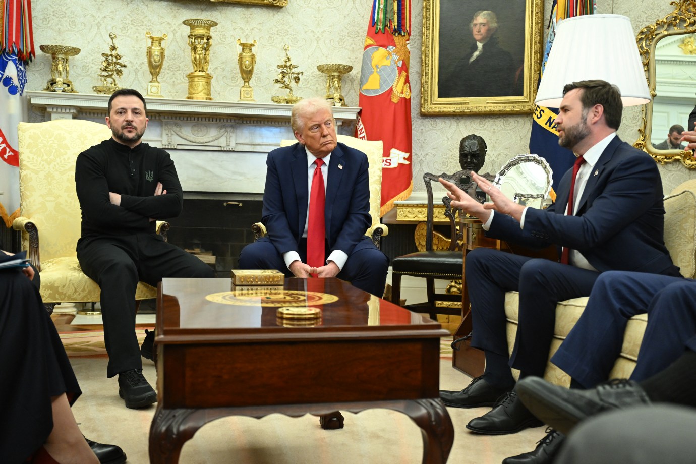 President Donald Trump and Ukraine President Volodymyr Zelensky listen to Vice President JD Vance as they meet in the Oval Office of the White House on February 28, 2025. (Photo by SAUL LOEB/AFP via Getty Images)