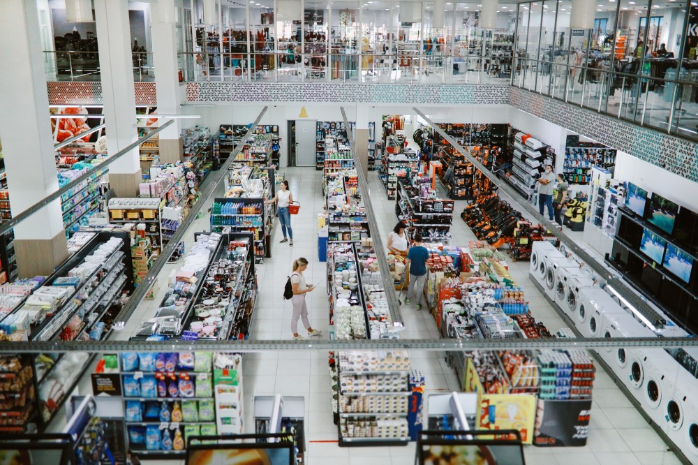 Overhead image of people buying in the large supermarket
