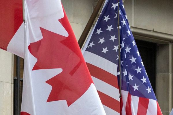 Flags outside the Fairmont Royal York in downtown Toronto, February 3, 2025.    (Photo by Andrew Francis Wallace/Toronto Star/Getty Images)