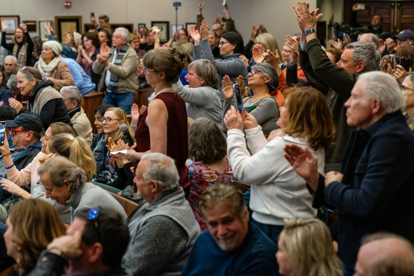 ROSWELL, GA – FEBRUARY 20- Attendees stand and clap and cheer f