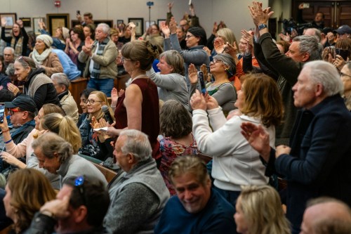 ROSWELL, GA – FEBRUARY 20- Attendees stand and clap and cheer f