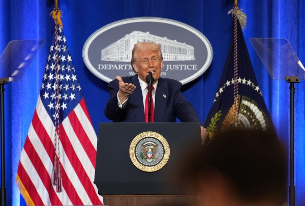 President Donald Trump gestures while speaking at the Justice Department on March 14, 2025. in Washington, D.C. (Photo by Andrew Harnik/Getty Images)