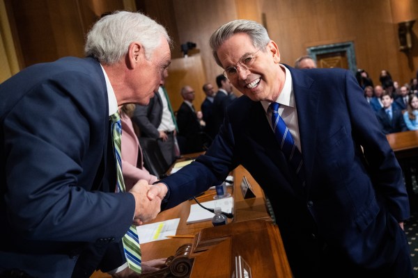 Scott Bessent greets Sen. Ron Johnson of Wisconsin before a Senate Finance Committee hearing on his nomination as Treasury secretary on January 16, 2025. (Tom Williams/CQ-Roll Call/Getty Images)