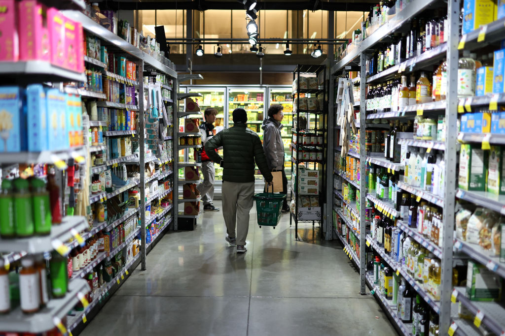 People shop in a supermarket in the Manhattan borough of New York City on February 20, 2025. (Photo by CHARLY TRIBALLEAU/AFP via Getty Images)