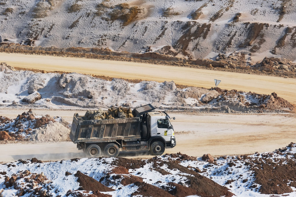Earth and minerals are loaded onto trucks at an open-pit mine near the frontline, despite the threat of bombing by Russian invading forces on February 26, 2025, in Donetsk Region, Ukraine. (Photo by Pierre Crom/Getty Images)