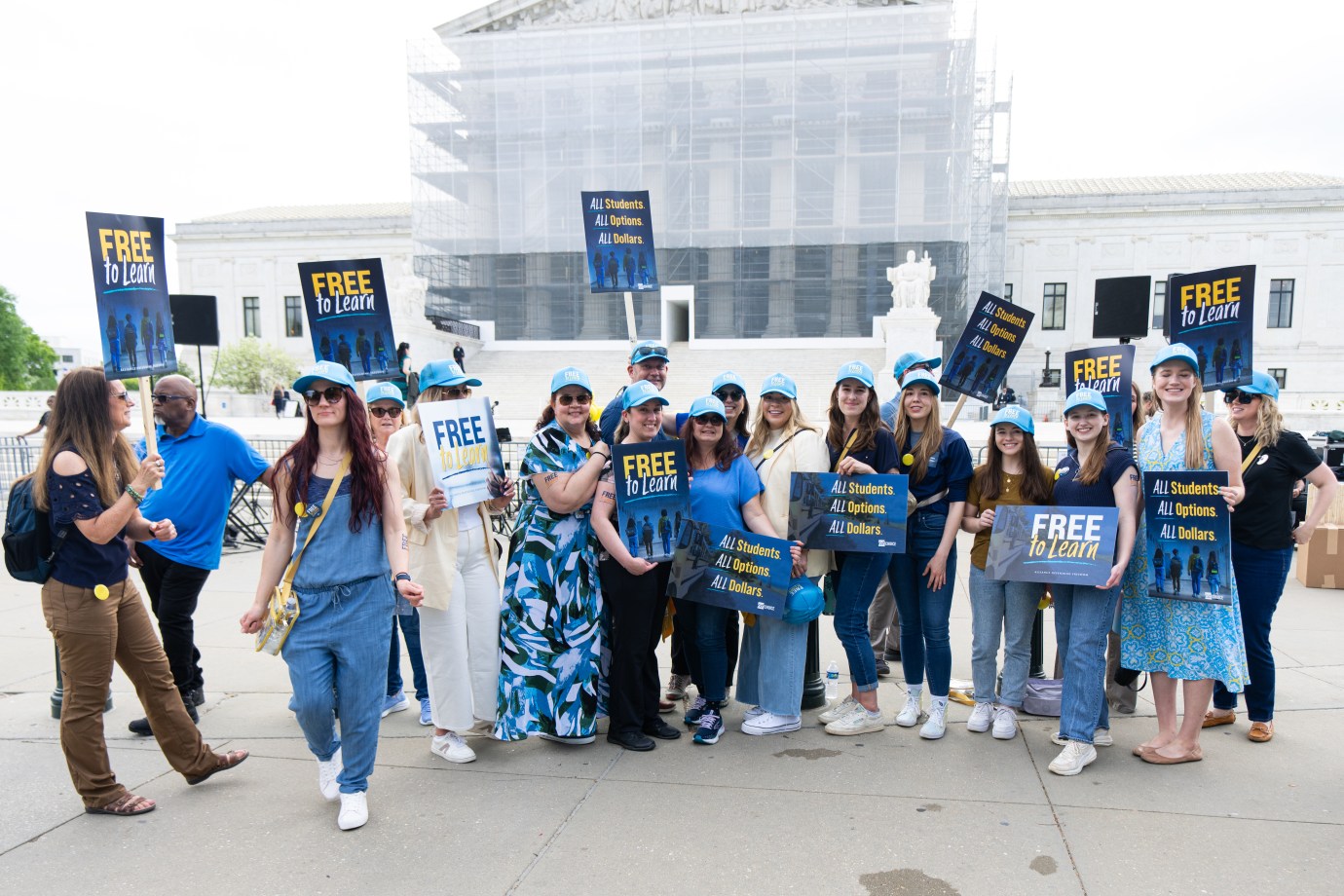 Activists hold "free to learn" signs as the U.S. Supreme Court prepares to hear the Oklahoma Charter School Board v. Drummond on Wednesday, April 30, 2025. (Bill Clark/CQ-Roll Call/Getty Images)