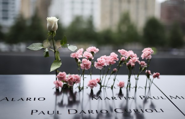 Loved ones pay their respects at the 9/11 memorial in New York City. (Photo by Bilgin S. Sasmaz/Anadolu Agency/Getty Images)