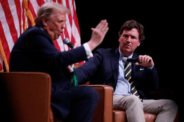 Donald Trump sits down for a conversation with Tucker Carlson during his Live Tour at the Desert Diamond Arena in Phoenix, Arizona, on October 31, 2024. (Photo by Chip Somodevilla/Getty Images)