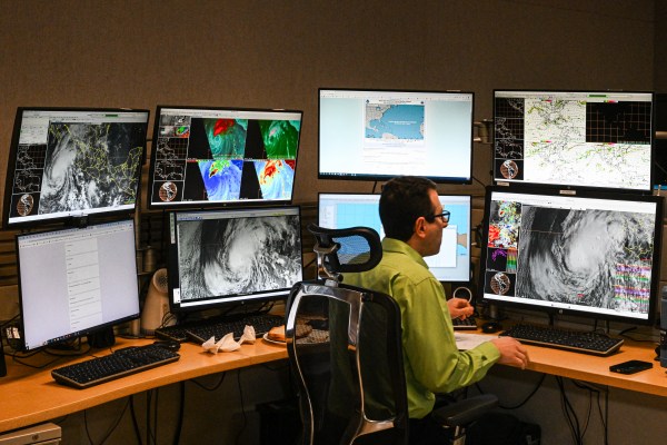 Weather forecaster Andrew Hagen works at his station at the National Oceanic and Atmospheric Administration's (NOAA) National Hurricane Center in Miami, Florida, on May 30, 2025. (Photo by Chandan Khanna/AFP via Getty Images)