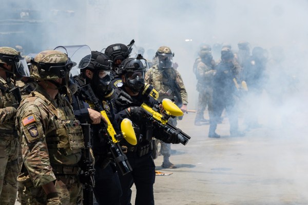 California National Guard stands guard as protesters clash with law enforcement in downtown Los Angeles at the Metropolitan Detention Center on Sunday, June 8, 2025. (Jason Armond/Los Angeles Times/Getty Images)