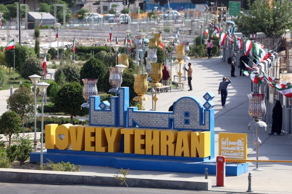 Iranians walk in Haft-e Tir Square in Tehran, Iran, on June 23, 2025. (Photo by Atta Kenare/AFP via Getty Images)