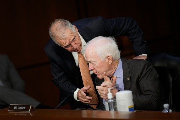 Sen. Thom Tillis talks to Sen. John Cornyn as U.S. Supreme Court nominee Judge Ketanji Brown Jackson testifies during her Senate Judiciary Committee confirmation hearing on March 23, 2022, in Washington, D.C. (Photo by Drew Angerer/Getty Images)