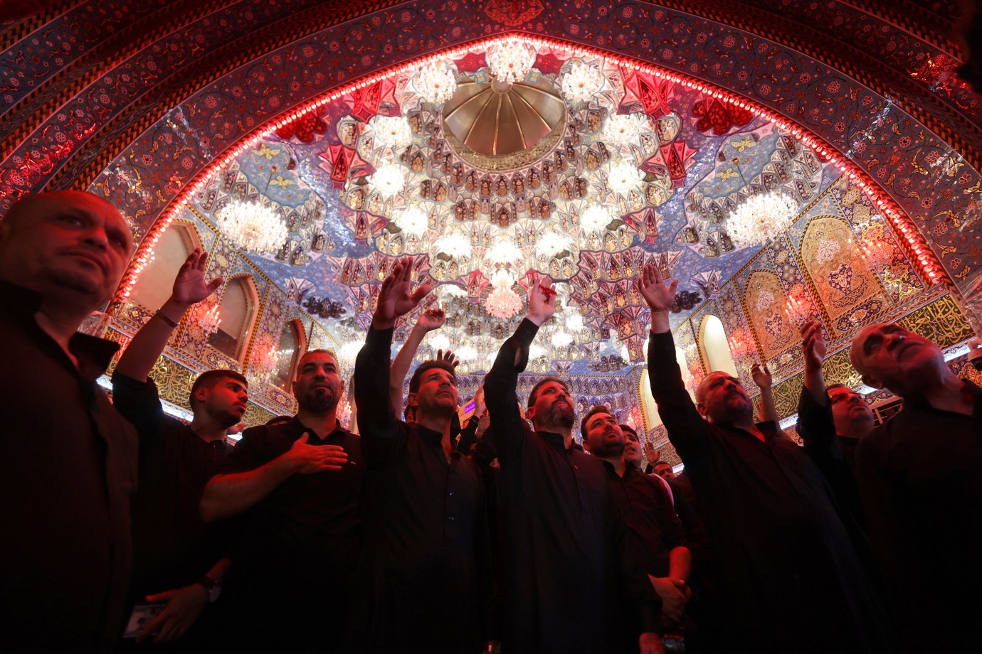 On July 4, 2025, Shiite Muslim worshippers in Iraq take part in a mourning ritual near the Imam Hussein Shrine on the eighth day of the Muslim month of Muharram, in the lead-up to Ashura, a 10-day period commemorating the seventh century killing of Prophet Mohammed's grandson Imam Hussein, in the holy city of Karbala . (Photo by AHMAD AL-RUBAYE/AFP via Getty Images)