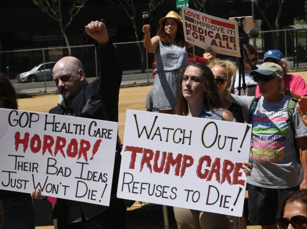 Protesters rally against Republican attempts to repeal the Affordable Care Act in Los Angeles, California, on July 29, 2017. (Photo by MARK RALSTON/AFP via Getty Images)