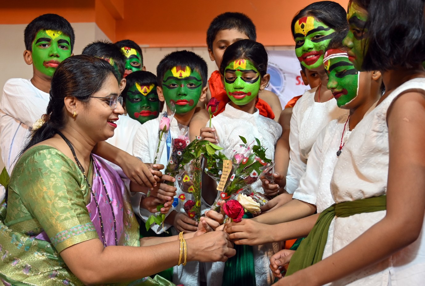 Students of Sane Gurji school offer flowers to their teacher during the celebration of Guru Purnima, on July 10, 2025, in Mumbai, India. Guru Purnima is a religious festival dedicated to offering respect to spiritual and academic gurus, celebrated as a festival in India, Nepal, and Bhutan by Hindus, Sikhs, Jains, and Buddhists. (Photo by Raju Shinde/Hindustan Times via Getty Images)