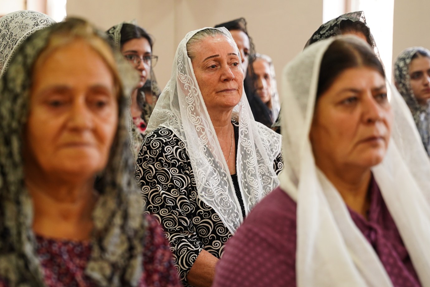 People attend a holy mass at the Martyrs’ Church in the town of Semel, located in the northern Iraqi province of Duhok, to mark the 92nd anniversary of Syriac Martyrs’ Day on August 7, 2025. The service was held on the anniversary of the Semel Massacre, which took place between August 8 and 11, 1933, when the Iraqi government of the time killed more than 3,000 Assyrian people. (Photo by Ismael Adnan Yaqoob/Anadolu via Getty Images)