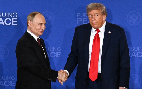 President Donald Trump and Russian President Vladimir Putin shake hands at the end of a joint press conference after participating in a US-Russia summit on Ukraine at Joint Base Elmendorf-Richardson in Anchorage, Alaska, on August 15, 2025. (Photo by DREW ANGERER/AFP via Getty Images)